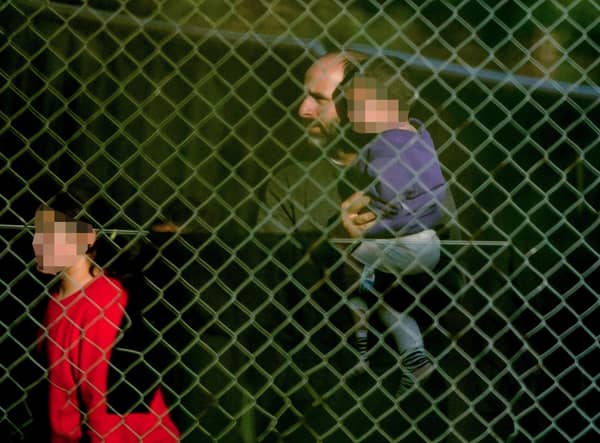 A view of people thought to be migrants at the Manston immigration short-term holding facility located at the former Defence Fire Training and Development Centre in Thanet, Kent. Picture: Gareth Fuller/PA Wire