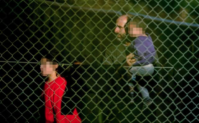 A view of people thought to be migrants at the Manston immigration short-term holding facility located at the former Defence Fire Training and Development Centre in Thanet, Kent. Picture: Gareth Fuller/PA Wire