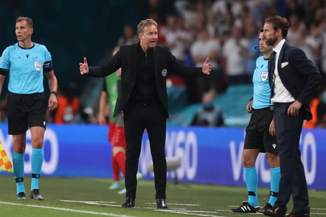 Denmark manager Kasper Hjulmand reacts during his side's controversial 2-1 extra-time defeat against England (Photo by CARL RECINE/POOL/AFP via Getty Images)