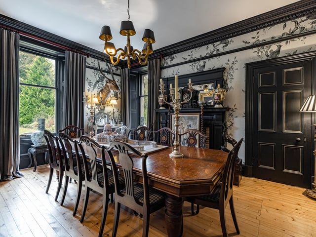 Interior: A large reception hall at ground level leads to a formal dining room and sitting room to the front, plus an office, library, and kitchen. A drawing room and four bedrooms are upstairs and there is an attic room.