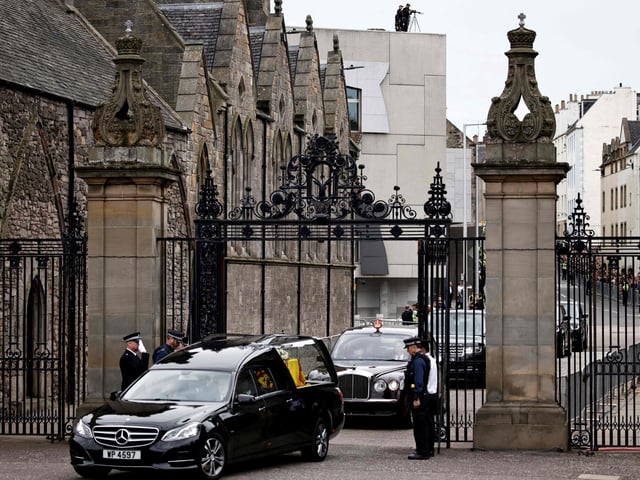 The hearse carrying the coffin of the late Queen Elizabeth II arrives at the Palace of Holyroodhouse in Edinburgh