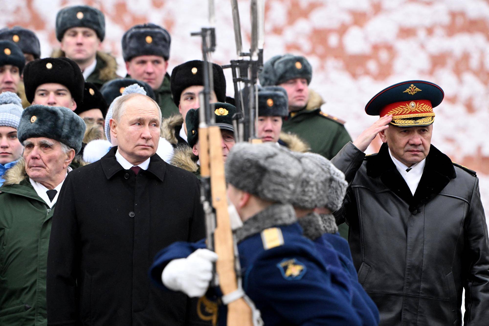 Russia's president Vladimir Putin, accompanied by defence minister Sergei Shoigu, attends a wreath-laying ceremony at the Tomb of the Unknown Soldier by the Kremlin Wall in Moscow. Picture: Sergei Savostyanov/AFP via Getty Images