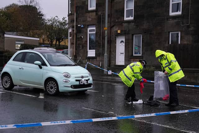 Police at the scene of a car crash on James Street in Carluke, South Lanarkshire. Three children and a woman have been taken to hospital after the crash which happened on Wednesday afternoon. Picture date: Wednesday October 27, 2021.