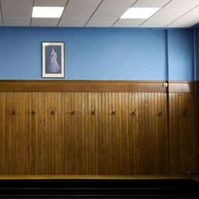 The Rangers home dressing room at Ibrox featuring a portrait of Queen Elizabeth.