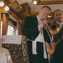 Right on song ... the train's musicians serenade passengers