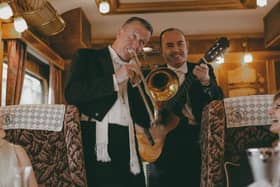 Right on song ... the train's musicians serenade passengers
