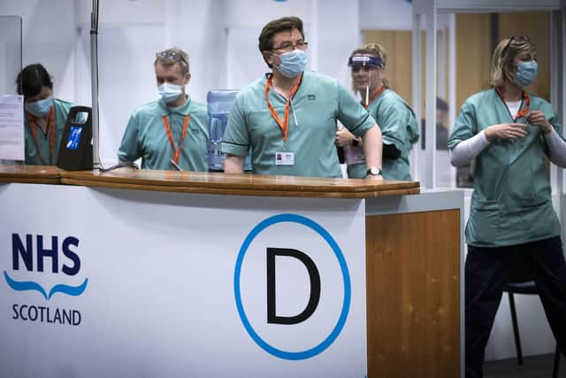 Members of the vaccination Team working at the coronavirus mass vaccine centre at the Edinburgh International Conference Centre.