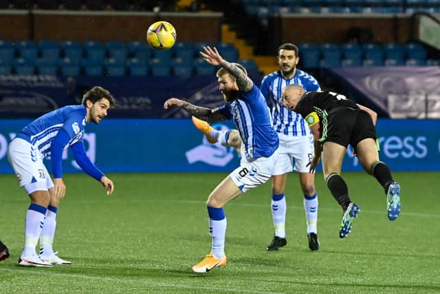 Celtic captain Scott Brown heads his side in front at Rugby Park. Picture: SNS