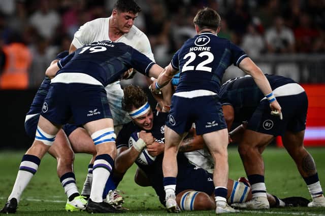 Scotland captain Jamie Ritchie in the thick of the action during the 30-27 defeat by France at the Geoffroy-Guichard Stadium in Saint-Etienne.  (Photo by JEFF PACHOUD/AFP via Getty Images)