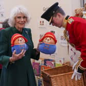 The Queen Consort personally delivered Paddington bears and other cuddly toys, which were left as tributes to Queen Elizabeth II at Royal Residences, to children supported by the charity.
