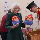 The Queen Consort personally delivered Paddington bears and other cuddly toys, which were left as tributes to Queen Elizabeth II at Royal Residences, to children supported by the charity.