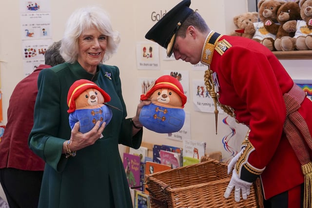 The Queen Consort personally delivered Paddington bears and other cuddly toys, which were left as tributes to Queen Elizabeth II at Royal Residences, to children supported by the charity.