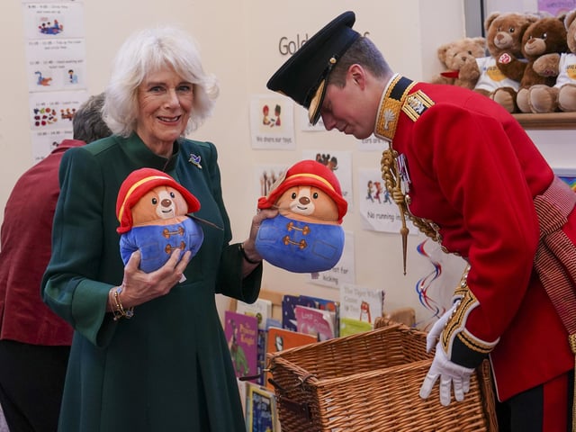 The Queen Consort personally delivered Paddington bears and other cuddly toys, which were left as tributes to Queen Elizabeth II at Royal Residences, to children supported by the charity.