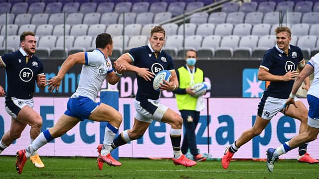 Scotland's Duhan van der Merwe outruns Italy fly-half Paolo Garbisi during last year's Autumn Nations Cup match in Florence. Picture: Vincenzo Pinto/AFP via Getty Images