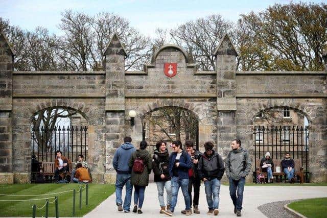 Students outside of the entrance to the Lower and Upper College Halls at the University of St Andrews. Picture: PA Media