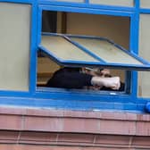 Rangers manager Steven Gerrard celebrates out the dressing room window with fans outside during a Scottish Premiership match between Rangers and St Mirren at Ibrox Stadium, on March 06, 2021, in Glasgow, Scotland. (Photo by Craig Williamson / SNS Group)