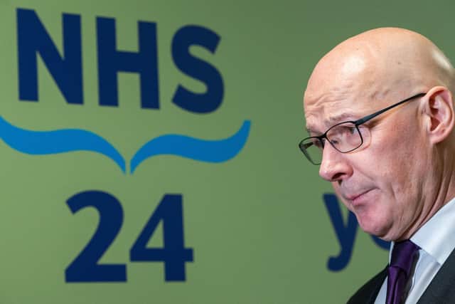 First Minister John Swinney during his visit to NHS 24 call centre in Dundee. Picture: Alan Richardson/PA Wire