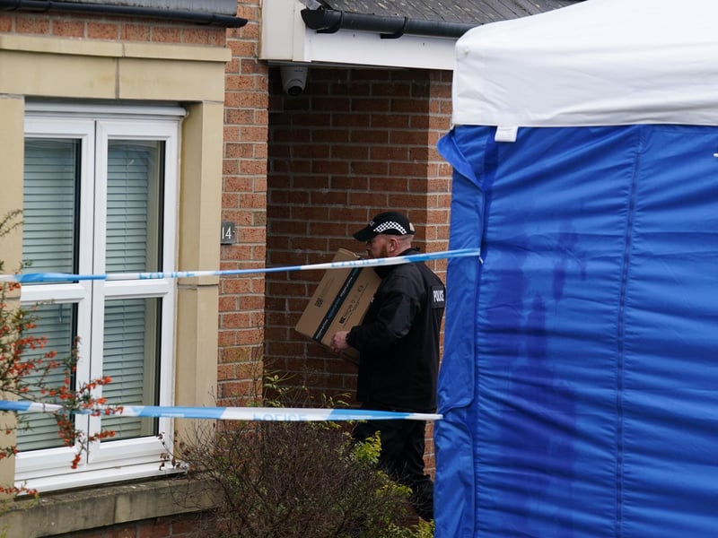 An officer from Police Scotland carries a parcel delivery into the home of former chief executive of the Scottish National Party (SNP) Peter Murrell, in Uddingston, Glasgow, after he was arrested in connection with the ongoing investigation into the funding and finances of the party.