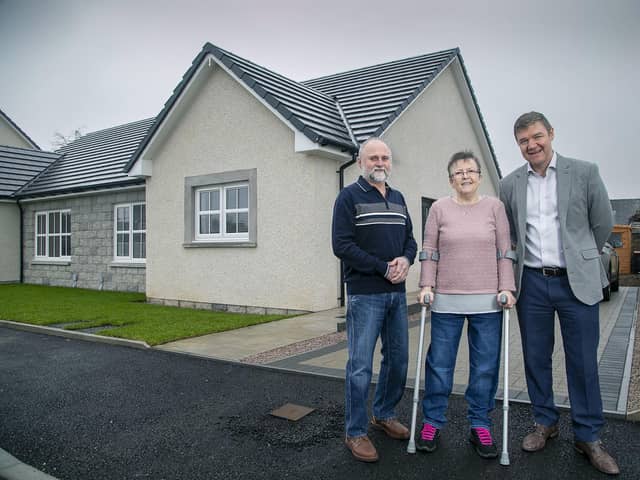 Alan and Jacqueline Scott with Allan Brown, managing director at Drumrossie Homes. (Pic: Rory Raitt)