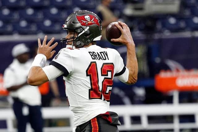 Tom Brady #12 of the Tampa Bay Buccaneers during warm ups before playing the Houston Texans in a NFL preseason game at NRG Stadium on August 28, 2021 in Houston, Texas. (Photo by Bob Levey/Getty Images)