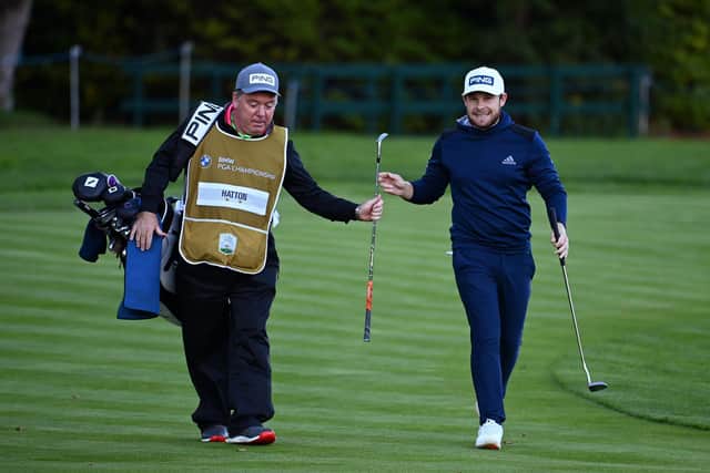 Tyrrell Hatton, right , and caddie Mick Donaghy on the 18th hole during the final round of the BMW PGA Championship at Wentworth. Picture: Ross Kinnaird/Getty Images