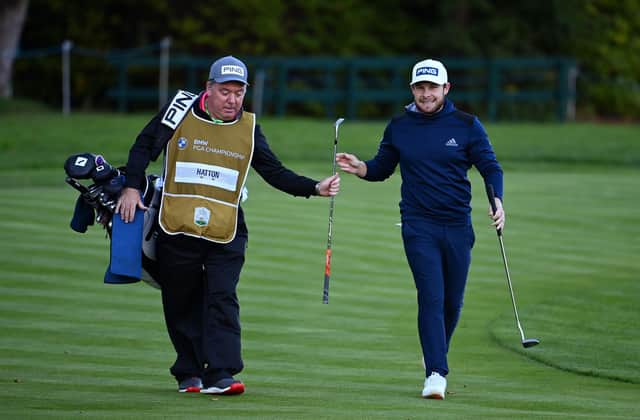 Tyrrell Hatton, right , and caddie Mick Donaghy on the 18th hole during the final round of the BMW PGA Championship at Wentworth. Picture: Ross Kinnaird/Getty Images