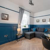 Attractively panelled and herringbone floored living space