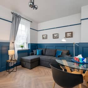 Attractively panelled and herringbone floored living space