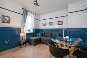 Attractively panelled and herringbone floored living space