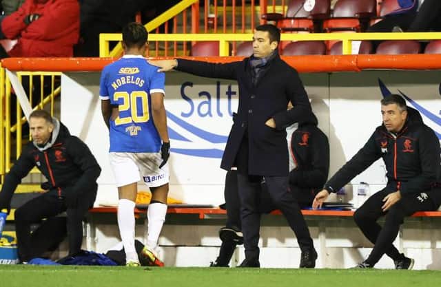 Rangers manager Giovanni van Bronckhorst gives striker Alfredo Morelos a pat on the back as he is substituted during the 1-1 draw against Aberdeen at Pittodrie. (Photo by Craig Williamson / SNS Group)
