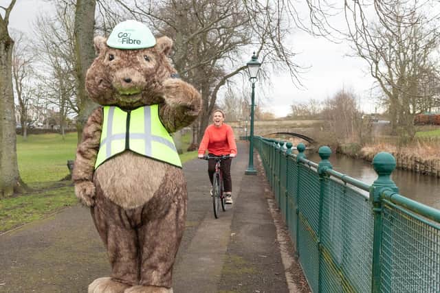 GoFibre's Digby the Gopher mascot leaves cyclist in the dust, thanks to the lightning-fast broadband speeds available on GoFibre’s network across towns in Scotland & the North of England
