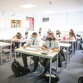 S5 and S6 pupils at St Columba's High School in Gourock, Inverclyde, wear protective face masks during their history lesson.