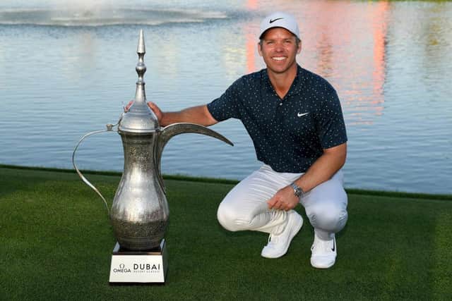 Paul Casey with the iconic coffee pot trophy after his four-shot win in the Omega Dubai Desert Classic at Emirates Golf Club. Picture: Ross Kinnaird/Getty Images.