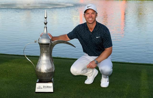 Paul Casey with the iconic coffee pot trophy after his four-shot win in the Omega Dubai Desert Classic at Emirates Golf Club. Picture: Ross Kinnaird/Getty Images.