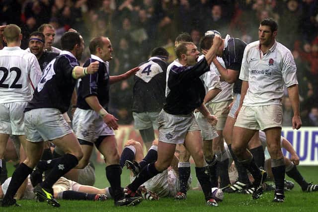 Scotland's win over England in 2000 wasn't pretty but it was celebrated with gusto. Here Duncan Hodge celebrates his try, with Gregor Townsend on his left. Picture: Ian Rutherford