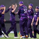 Scotland's players celebrate after the dismissal of Bangladesh's Liton Das during the ICC mens Twenty20 World Cup cricket match between Bangladesh and Scotland at the Oman Cricket Academy Ground in Muscat on October 17, 2021. (Photo by HAITHAM AL-SHUKAIRI/AFP via Getty Images)