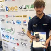 James Rankin with his certificate after finishing third in national competition