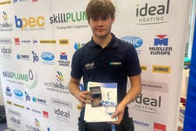 James Rankin with his certificate after finishing third in national competition