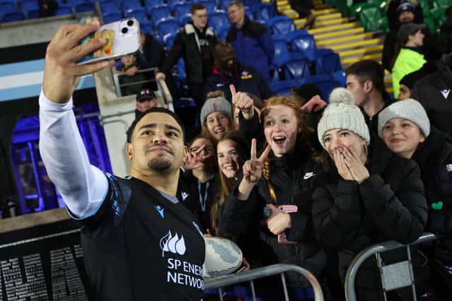 Sione Tuipulotu with fans after Glasgow Warriors' 20-9 win over the DHL Stormers at Scotstoun. (Photo by Ross MacDonald / SNS Group)