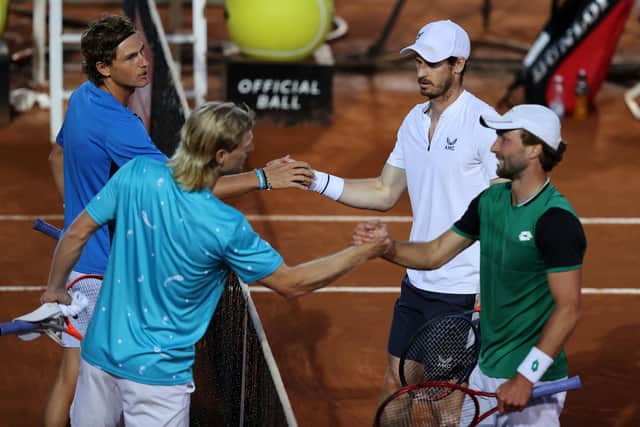 Liam Broady and Andy Murray shake hands with Aussie pair Max Purcell and Luke Saville. Picture: Clive Brunskill/Getty Images