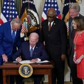 US President Joe Biden signs the Inflation Reduction Act, which includes the biggest package of climate change measures in US history, in August last year (Picture: Mandel Ngan/AFP via Getty Images)