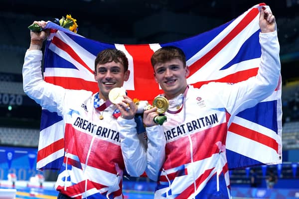 Great Britain's Tom Daley (left) and Matty Lee celebrate winning gold in the Men's Synchronised 10m Platform Final at the Tokyo Aquatics Centre. Picture: Adam Davy/PA Wire