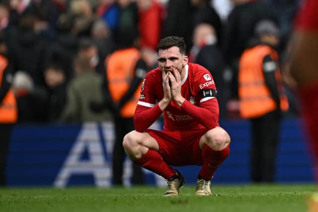 Scotland captain Andy Robertson slumps to the turf after Liverpool's 1-0 defeat to Crystal Palace at Anfield. (Photo by PAUL ELLIS/AFP via Getty Images)