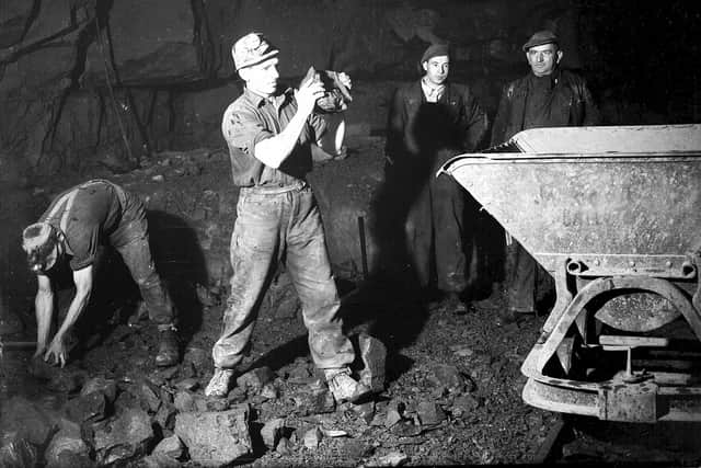 Miners filling a skip at Cousland Colliery, Midlothian. 