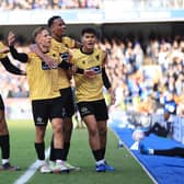Sam Corne of Maidstone United celebrates with team-mates after defeating Ipswich in the FA Cup.