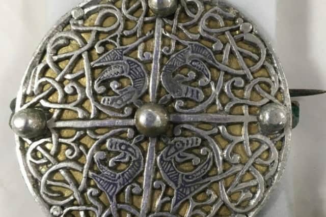 The newly conserved silver brooch which was buried more than 1000 years ago as part of the Galloway Hoard. PIC: NMS.