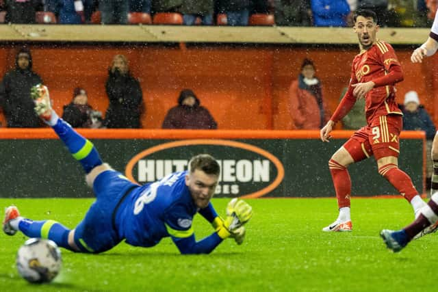 Bojan Miovski beats Zander Clark with this effort to equalise for Aberdeen against Hearts.