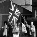 Ron Hill starts the climb at Portobello with flags flying - he went on to win Gold medal.