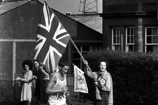 Ron Hill starts the climb at Portobello with flags flying - he went on to win Gold medal.