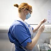 A nurse prepares a Covid-19 vaccine. Picture: PA Media